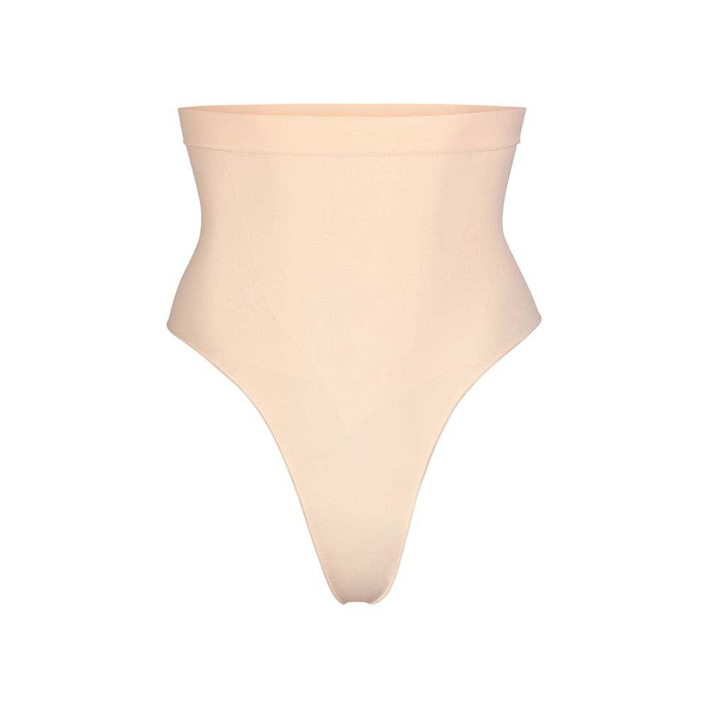 Skims SCULPTING MID WAIST Thong Sand | TAUO74960